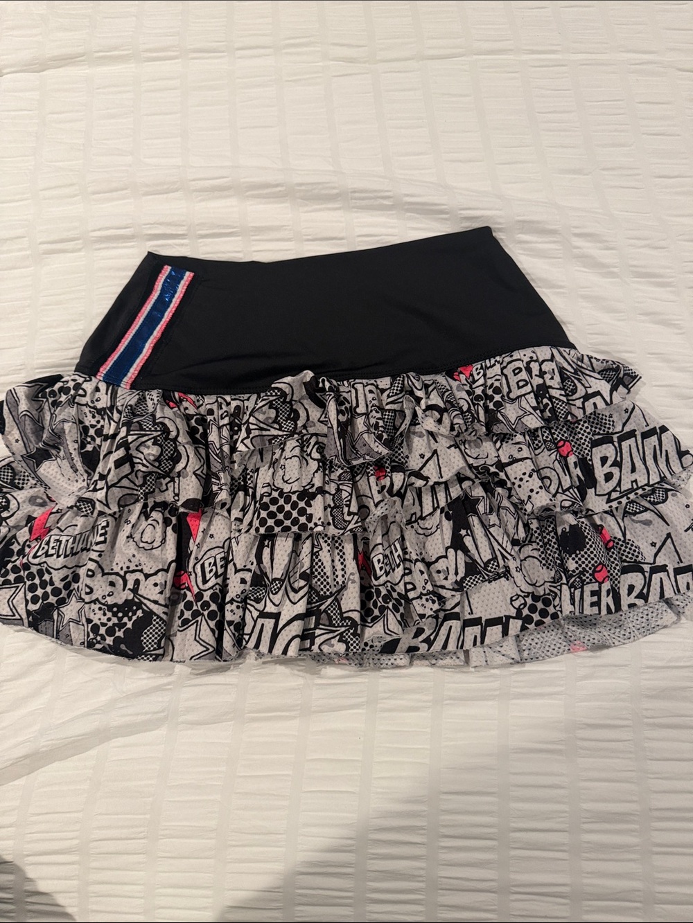 Lucky in love. Tennis skirtBlack Comic-Print Ruffle Mini Skirt with Pink Accents